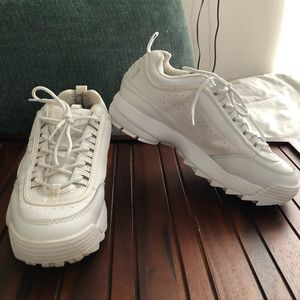 All white Fila platform shoes